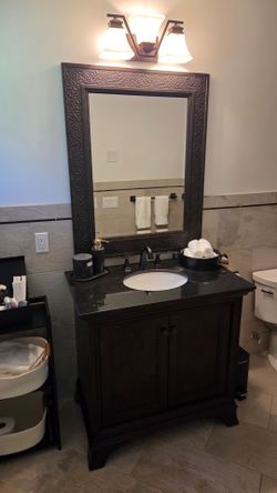 Bathroom Vanity, mirror, and faucet