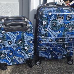 2 suitcases, carry-on luggage, young. Hard case. 4 wheels.