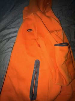 orange nike tech zip up