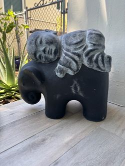Shaolin Monk on Elephant Buddha Statue