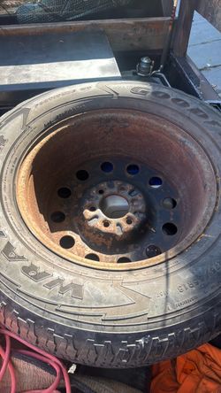 Two 75–65R 18 tire and rim