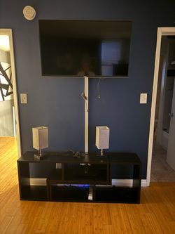 TV, cabinet and lamps