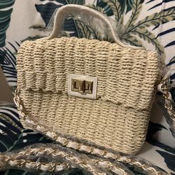 Elegant woven handbag with gold accents