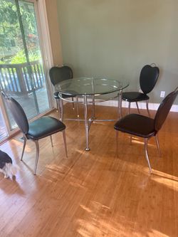 Kitchen table with  4 chairs and glass top