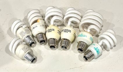Assorted used and new compact fluorescent lamps (CFLs)