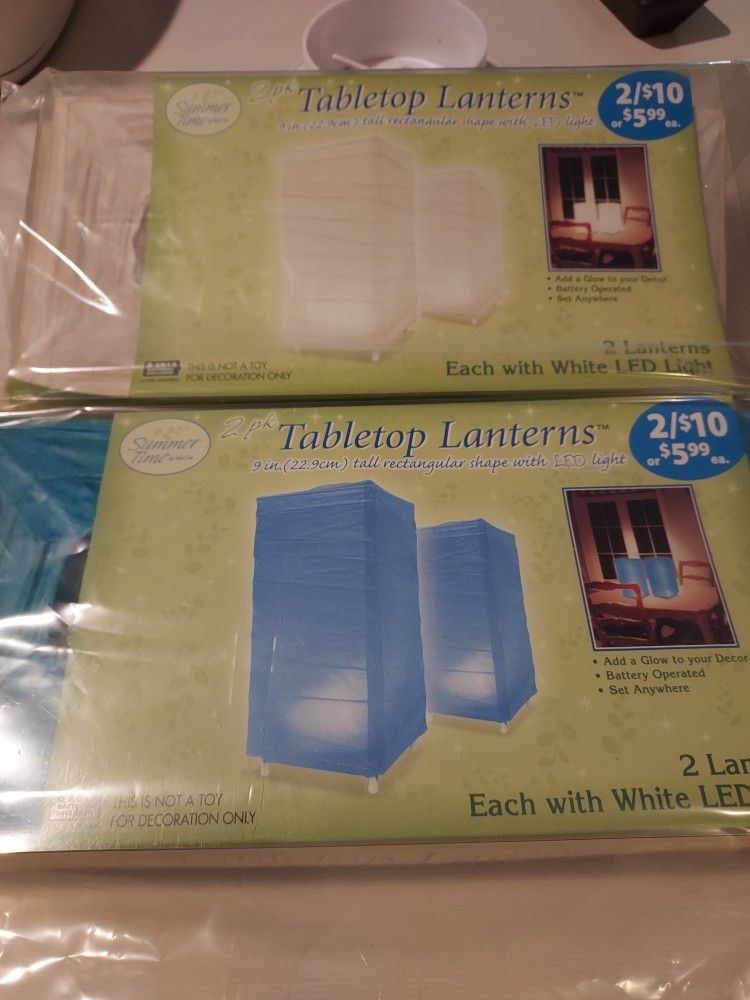 9 X 5 Inch Table Lanterns, Rectangle. 2032 Button Batteries. 2 White  2 Turquoise.  New In Box, Never Used. Both For $10. MUST P/U IN MARYSVILLE 