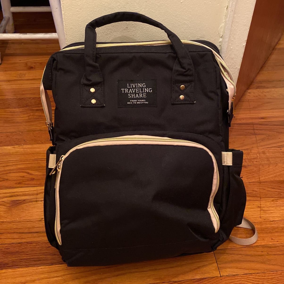 Diaper backpack with changing station