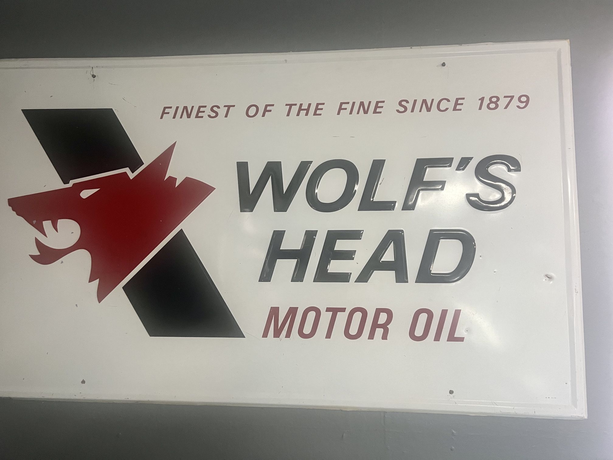 Embossed NOS Wolf ‘s Head Gas Oil Advertising Sign