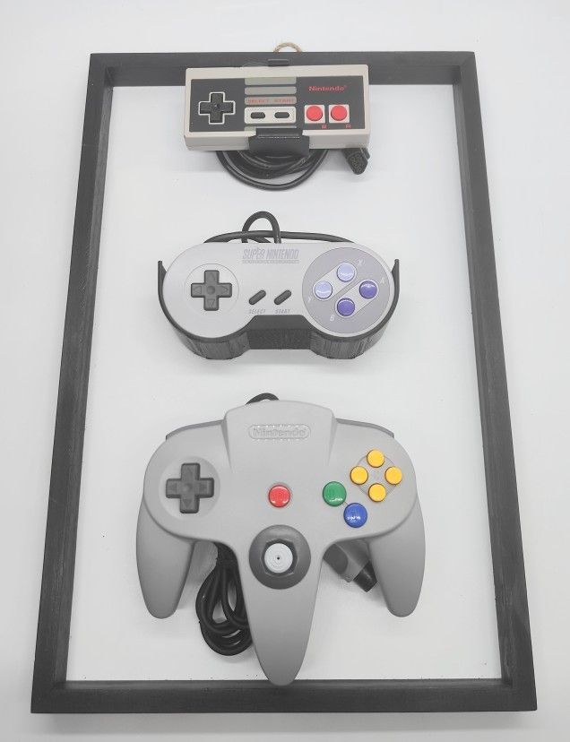 Nintendo OEM NES SNES N64 Controllers mounted on 11x17 Frame