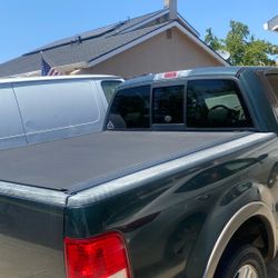 Revolver, truck bed cover new in the box.