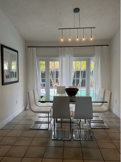 ARTEFACTO DINING TABLE. Glass top 3/4” thick and 70”x70”