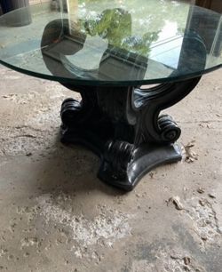 Round glass topped dining/statement table