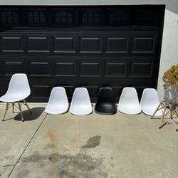 Eames-style molded plastic chairs.