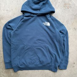 The North Face blue hoodie with white logo
