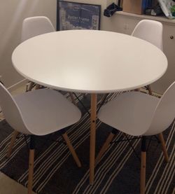 White dining table (chairs not included)