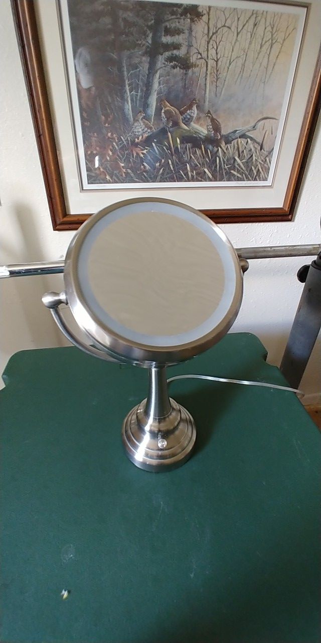 Lightly used Intertek lighted vanity mirror on a stand with a magnifier