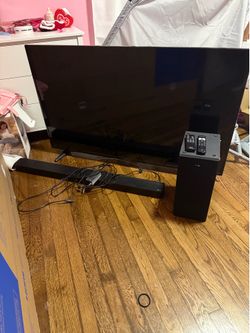 55” tv with an LG sound bar and subwoofer bundle.