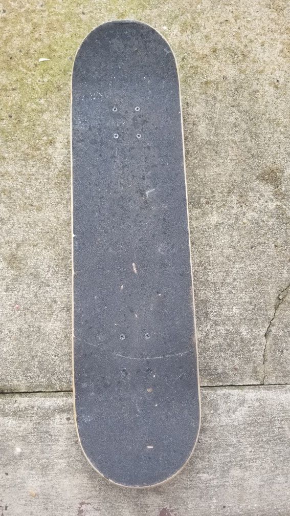 Black and brown skateboard deck