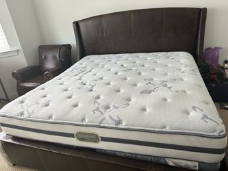 Beautyrest Recharge King bed with mattress, and chair.