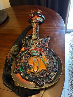 One of a kind, handmade guitar to hang it was at the state fair. I made it for a exhibit up or put on a stand
