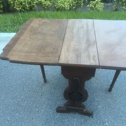 Antique Victorian Eastlake Gate-Leg Drop Leaf Parlor Game or Small Dining Table.  Used in good condition with minor cosmetic blemishes. These blemishe