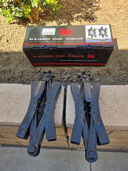 Camper wheel chock stabilizers
