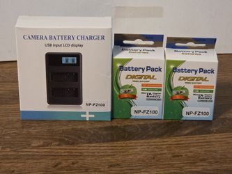 New Camera Charger And 2 Batteries 