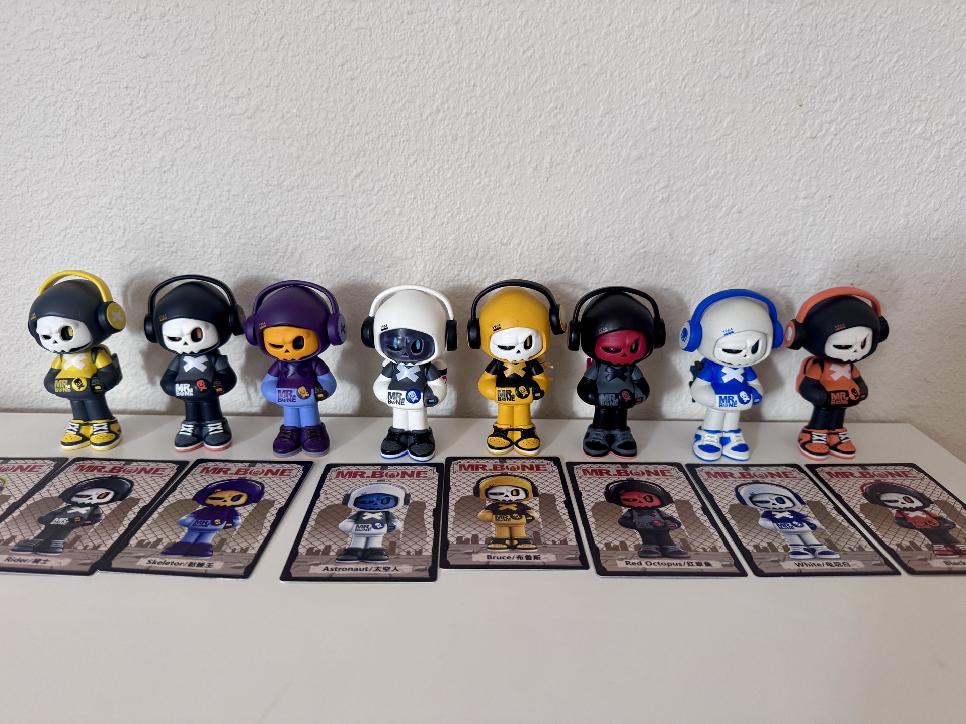 Set of 8 Mr. Bone collectible figures with cards.