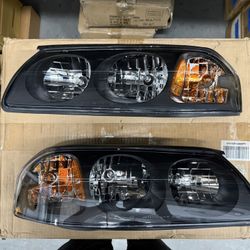 Headlights For 2000 To 2005 Chevy Impala; Black Housing With Amber Corners ./ Luces Negras 