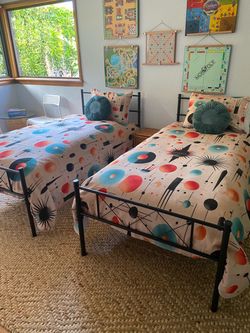 2 twin bed frames and bedding