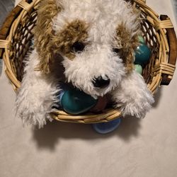 Stuffed animal dog in wicked basket for easter