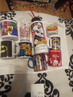 7 Vintage glass Mugs And 2 Plastic...Very Collectible From 90s One Is From 1978 Garfield .,..Will Negotiate On Price ...
