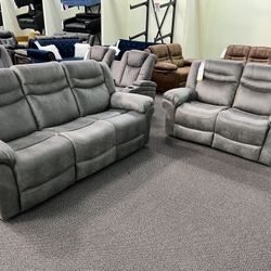 New Power Reclining Couch / Love Seat .  Grey Breathable Leatherette .  Free Delivery !