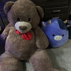Huge bear stuffed animal and cow squishmello  