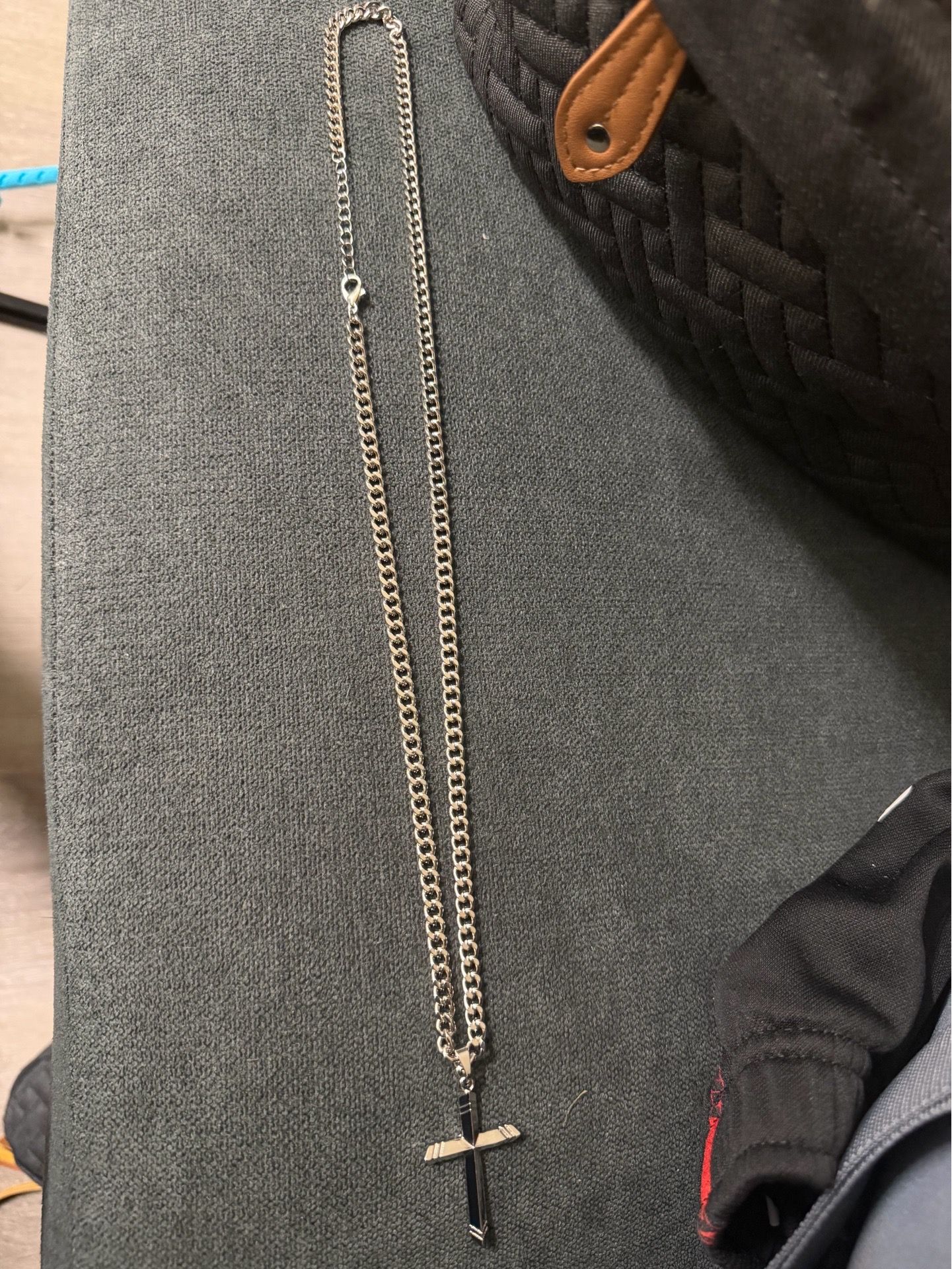 This is a gold-colored cross pendant on a matching chain..