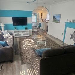 Modern living room furniture set in great condition from a clean, smoke-free home.

Includes:

Two matching sofas, Coffee table, Rug, and more 
