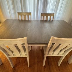 Extendable dining table with 4 free chairs included.