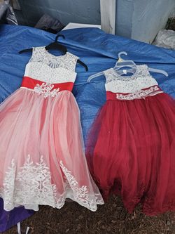 2 beautiful girls dresses. Great for Easter or a wedding. The on says size 6-7 the other has no tag.