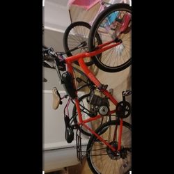 Red Bike With A Gas Motor On It 