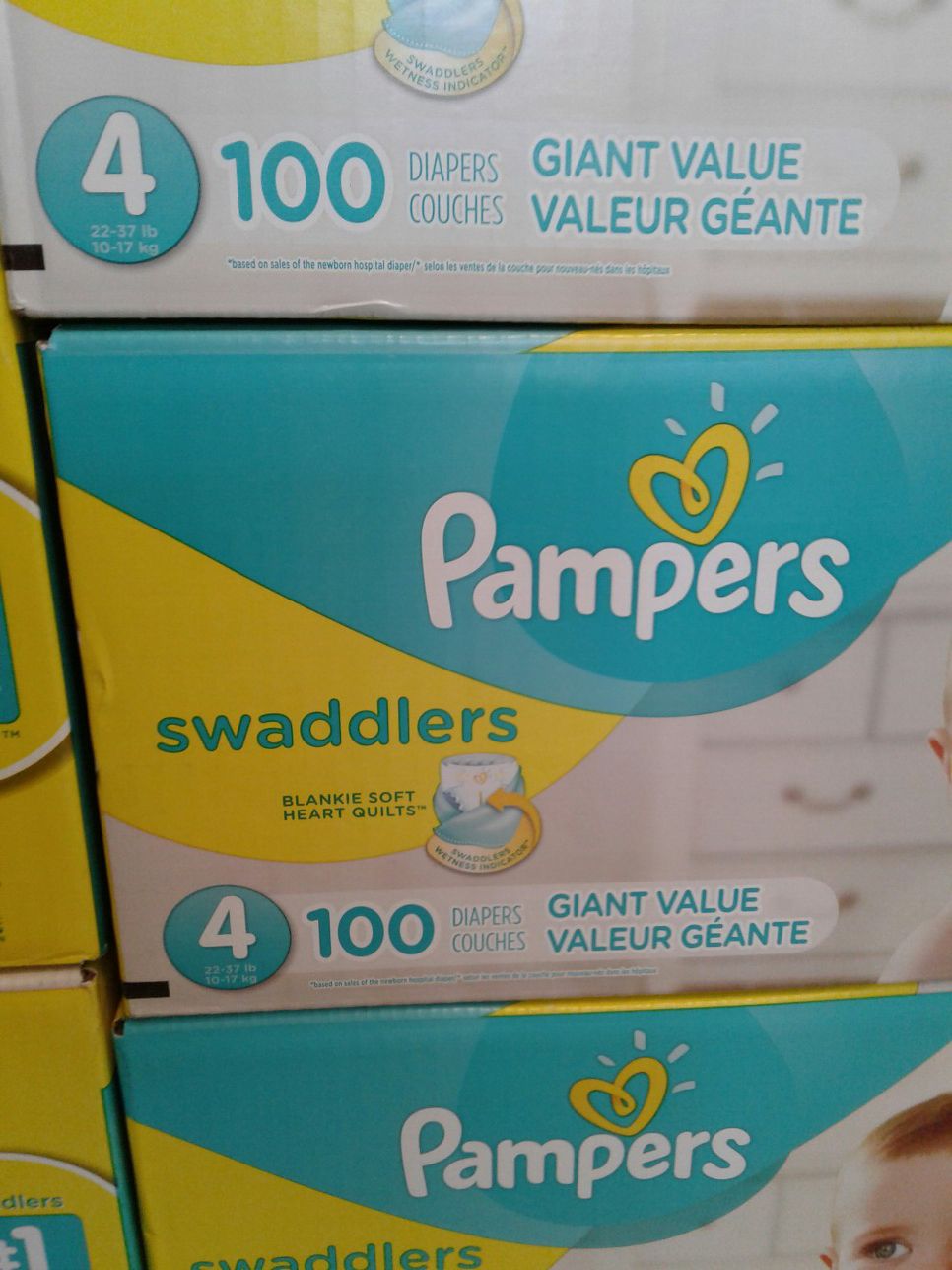 Pampers Swaddlers diapers size 4, three boxes of a hundred count at $25 each or all three for $65