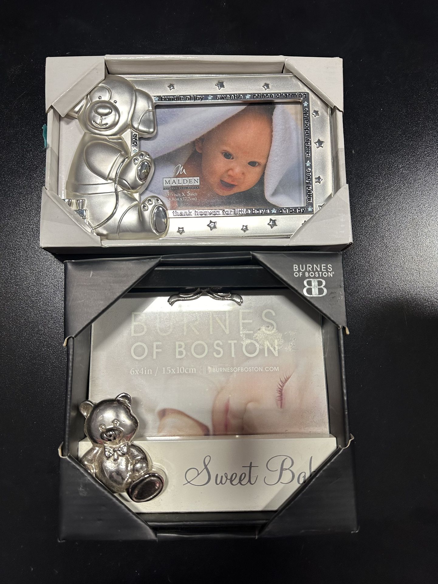 Brand new, heavy baby frames. $5