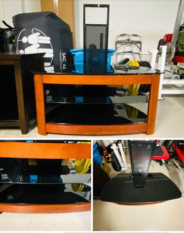 TV Stand with Black glass, metal and medium wood tone.