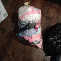Bag With Clothes And Shoes Inside Of It And More