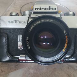 Minolta 35mm Camera With 200mm Lens