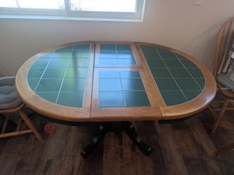 Dining table with folding leaf