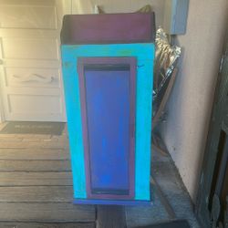 Multi-Colored Wooden Cabinet With Shelves