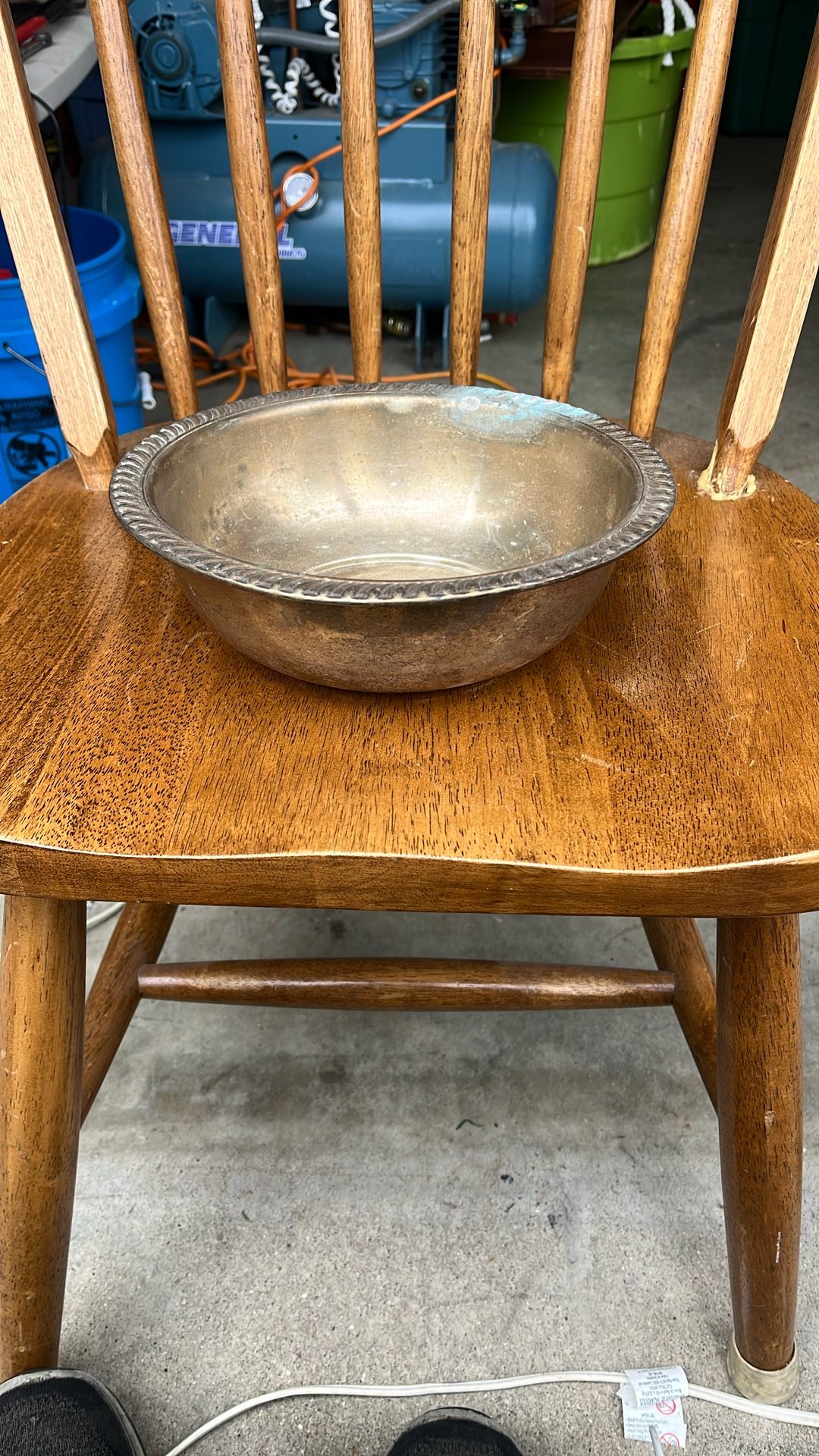 Based on the visual characteristics, the item appears to be a vintage silver-plated bowl with a decorative rim. This type of bowl is often referred to