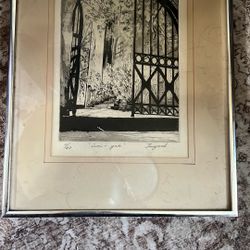 black and white etching or print titled "iron-gate" and signed by an artist named Jaugard. The piece is numbered 1/60, indicating it is from a limited