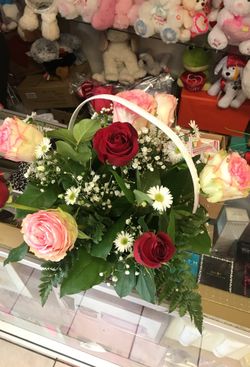 Red and pink roses basket