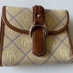Dooney & Bourke Vintage Monogram compartment wallet is in excellent condition, gently used with little to no wear whatsoever. Faux buckle at the front